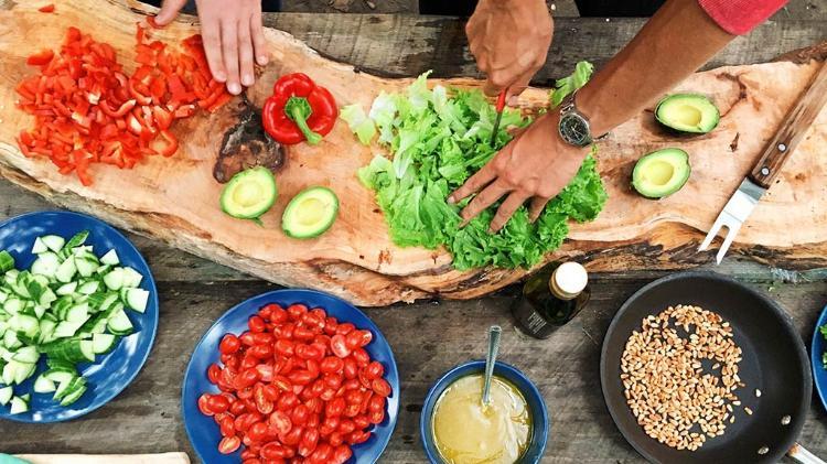 Birds eye view of of 2 people preparing food