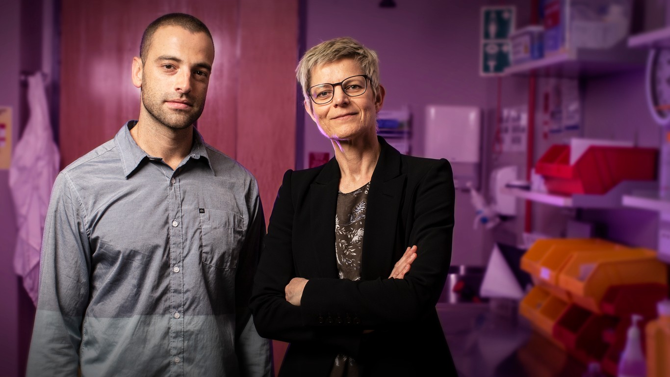 Dr Vida Bliokis and PhD candidate Vinicius de Rosariois standing in lab