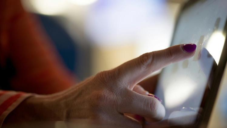 Woman using a touch screen mobile device