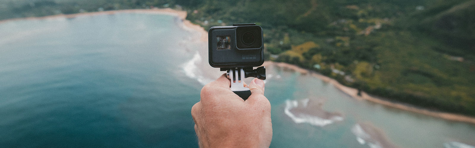 Hand holding a GoPro camera