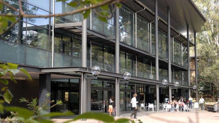 Photo of the 51 Campus Library, with large glass windows, from the outside view