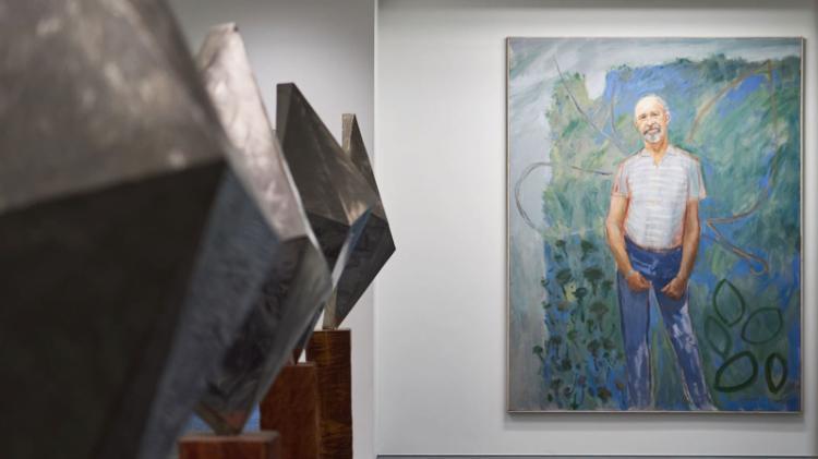 Geometric, metallic sculptures by Bert Flugelman and a portrait of the artist