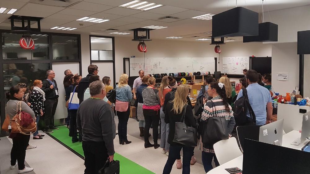 20 people on a tour of the UOW Student Makerspace