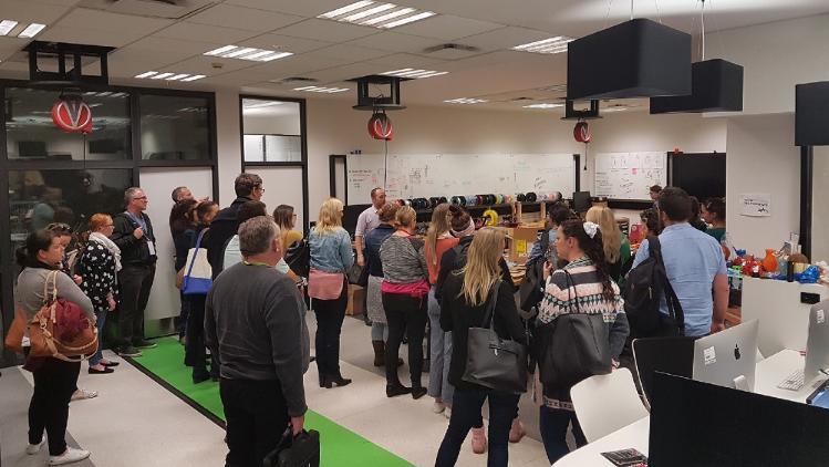 20 people on a tour of the UOW Student Makerspace