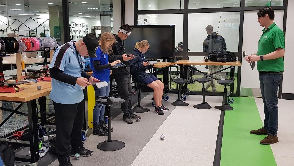 Four students using ipads during a workshop in the UOW Student Makerspace