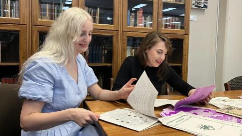 Ellie and Emma, Liz Hilton Fellows, reading archival materials, 2025