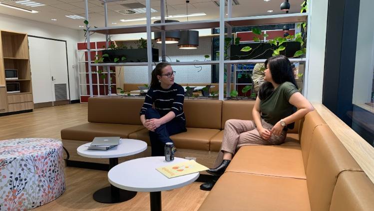 Students talking in the Library lounge / kitchen / kitchenette