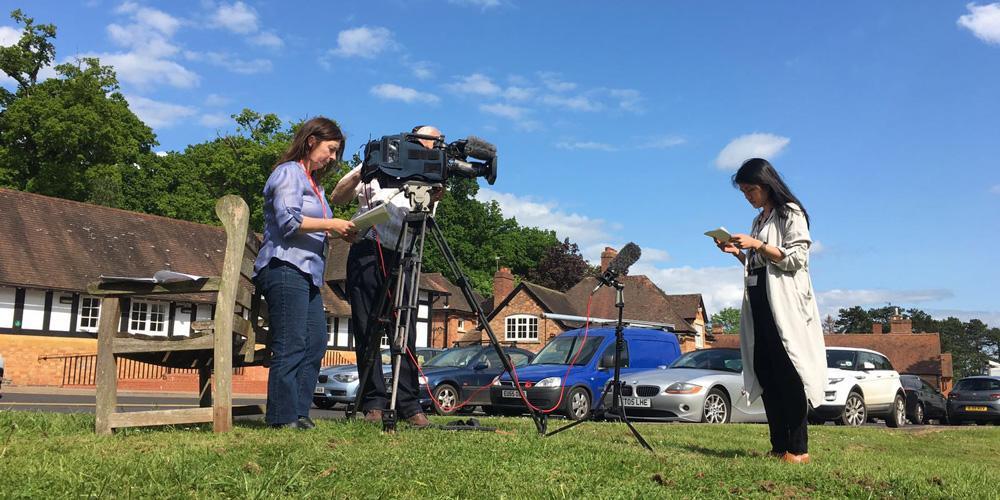 Lu reporting on location