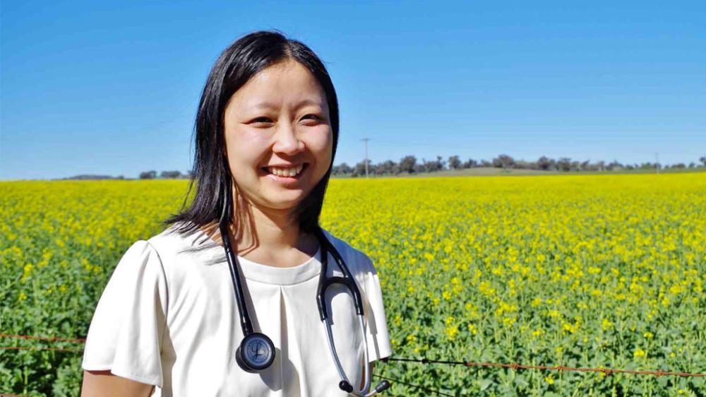 Dr Teena Downton standing in a rural field