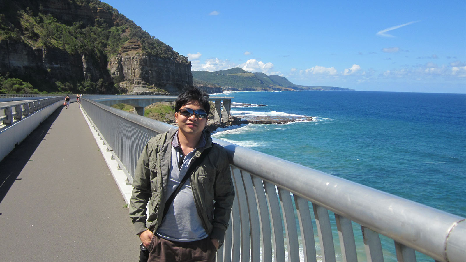 Dr Thong Pham is standing on Seacliff Bridge