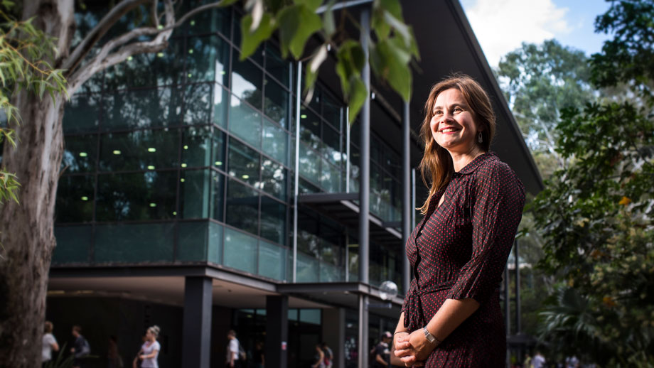 Lyn Phillipson standing out front of library