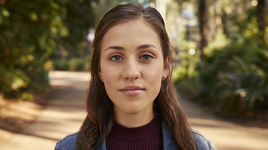 UOW student Olivia standing at UOW Wollongong campus