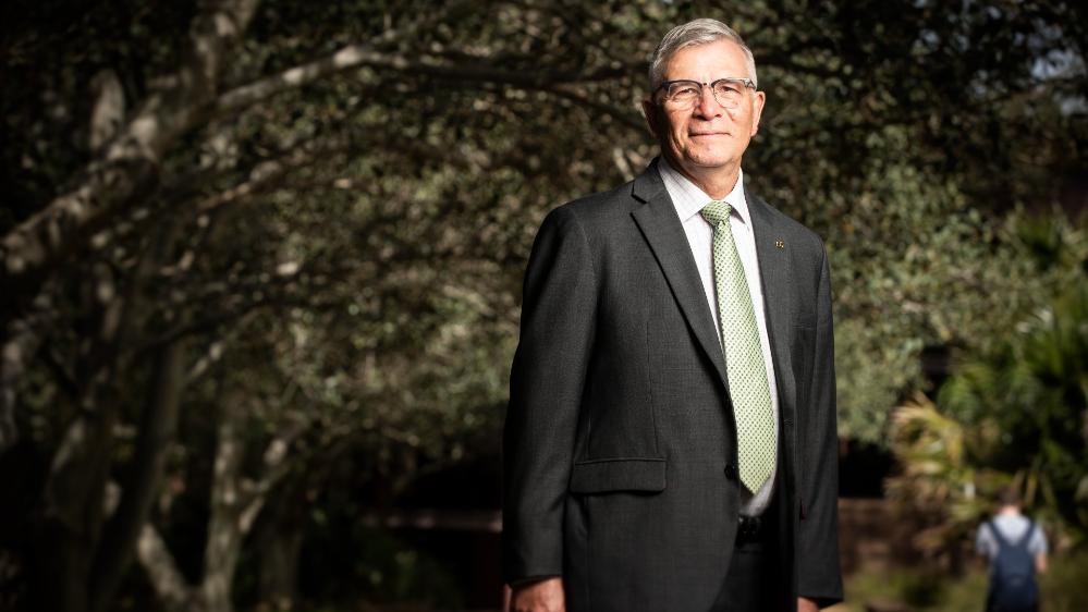 UOW Senior Deputy Vice-Chancellor Professor Joe Chicharo stands on Wollongong campus. Photo: Paul Jones