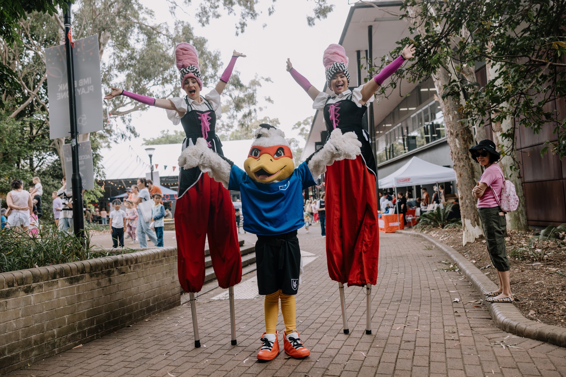 baxter and performers smiling at camera