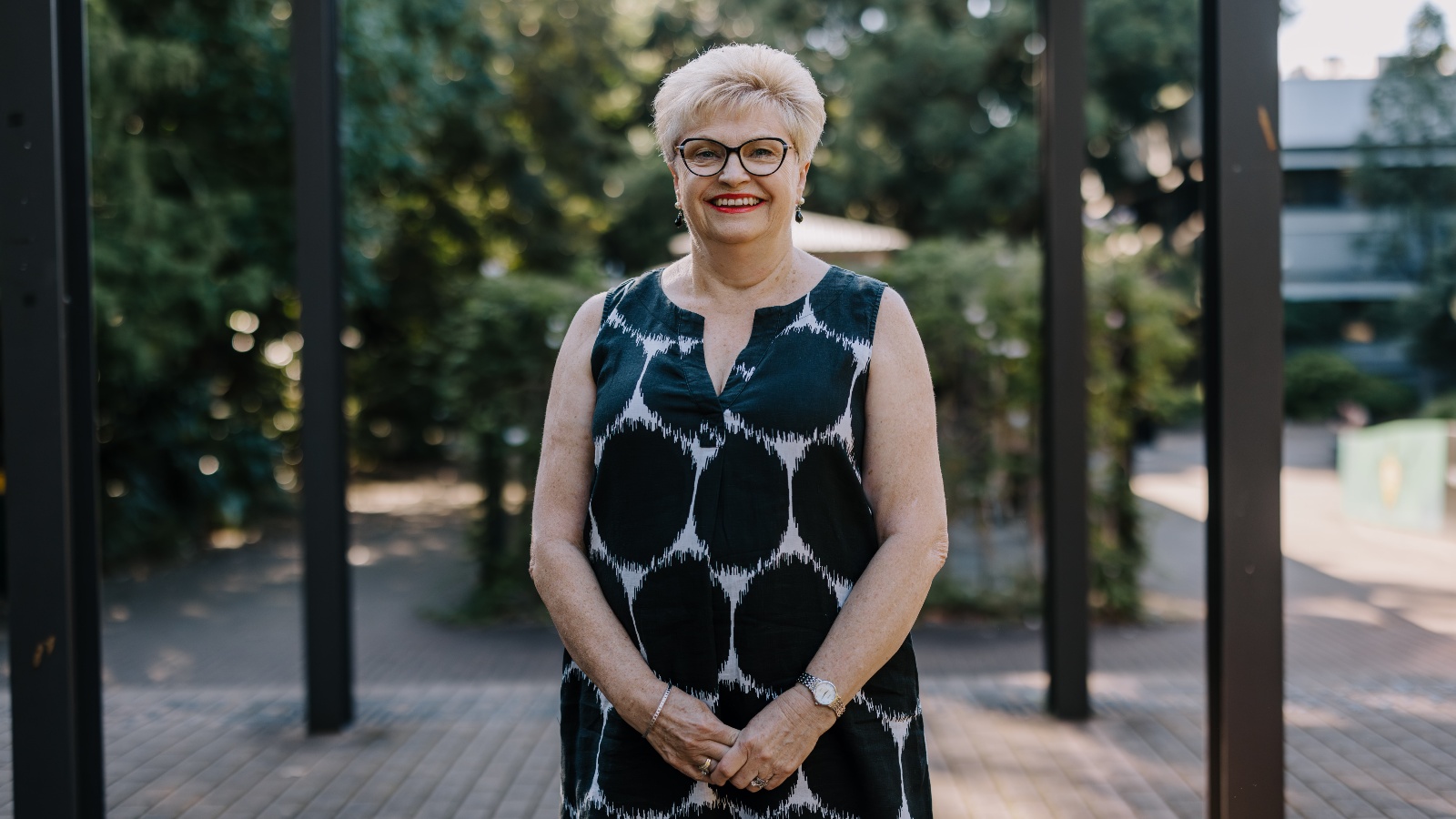 Kerrie Gamble standing in front of the garden