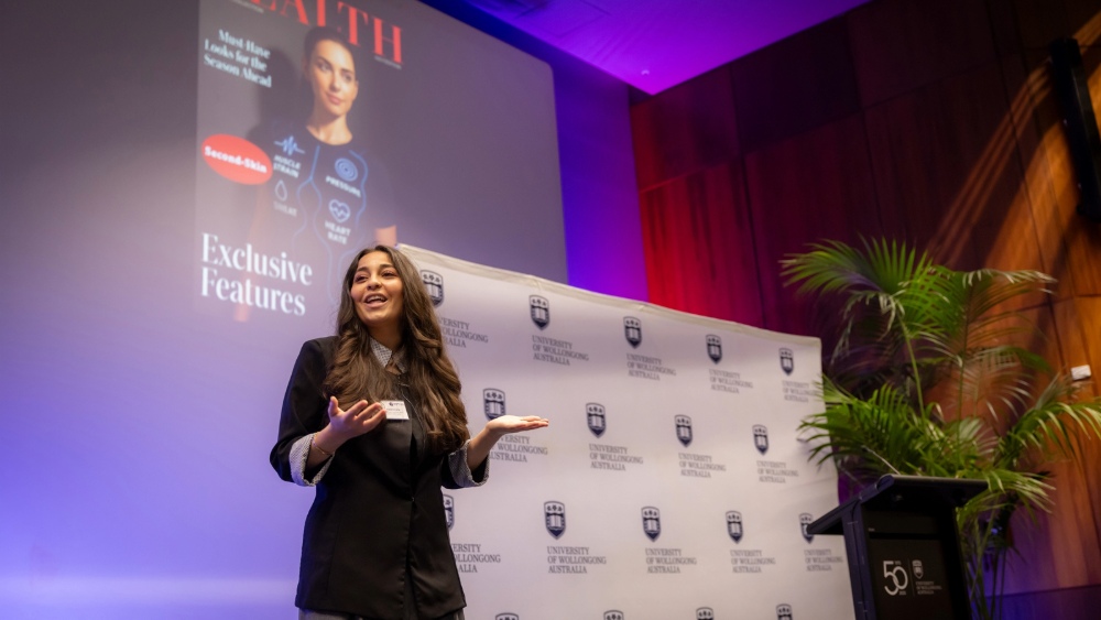 A woman presenting on a stage