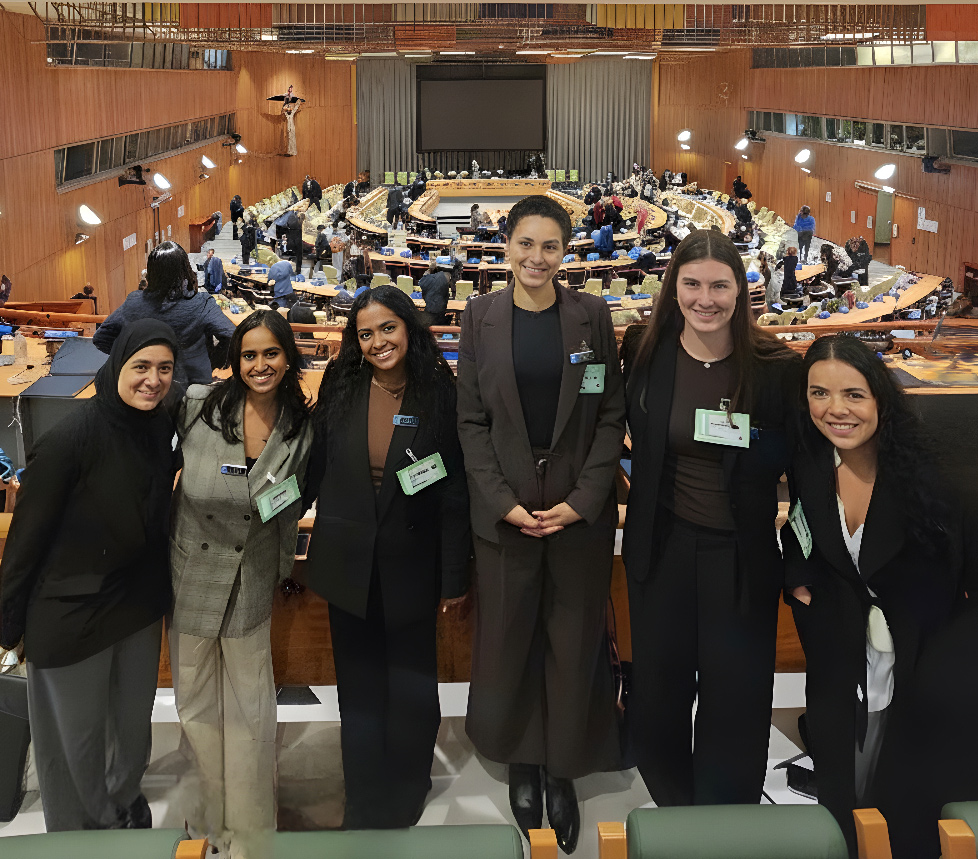 A group of women stand in Parliment House, Canberra