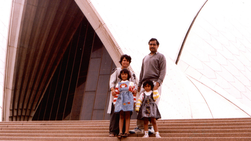 Anuradha Gupta with her husband and two young daughters pictured at the Sydney Opera House steps