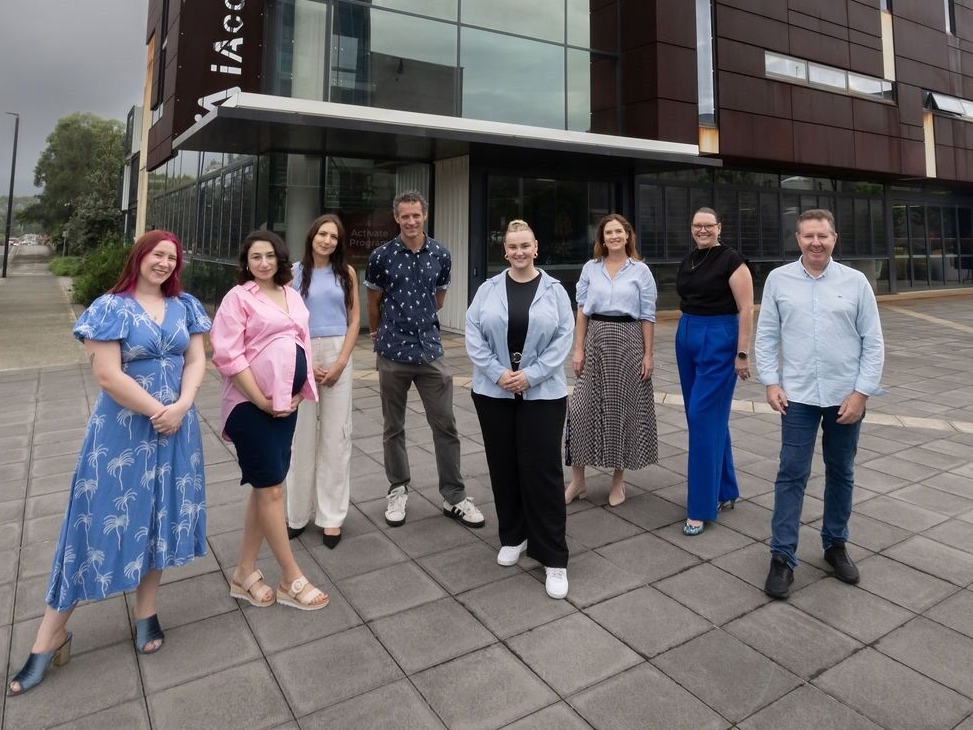 The team of iAccelerate staff stand in front of the iAccelerate Centre at Innovation Campus, March 2026. Photo: Mark Newsham