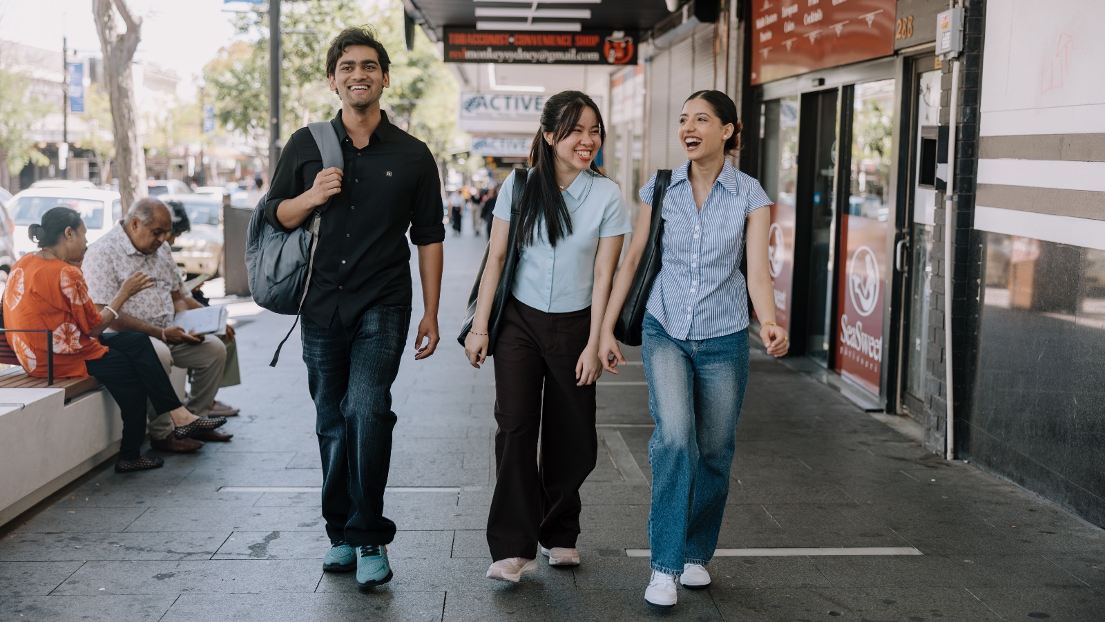 three students walking around Liverpool area