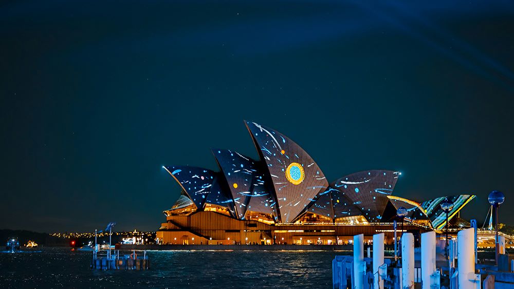 Lighting of the Sails at Vivid Sydney in 2022. The Martumili collective painting Yarrkalpa - Hunting Ground, Parnngurr Area 2013 is projected onto the Sydney Opera House by creative technologists, Curiious.