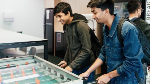 Students playing foosball