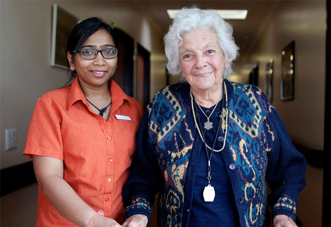 Senior and nursing staff pose for photo