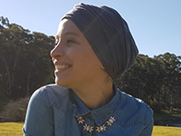 Ouraida Belhaffef looking to the left, wearing a beanie