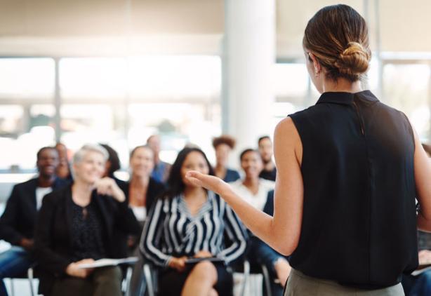 presentation by speaker in front of small audience