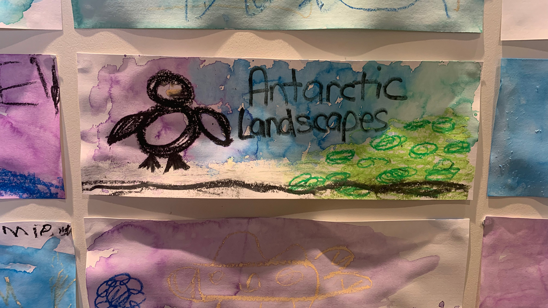 Child's art depicting a penguin and 