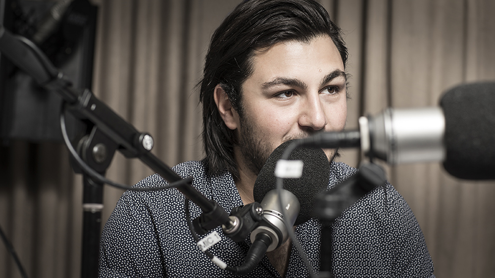 UOW student Jake Troncone in a media studio