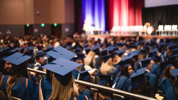 Image of graduates sitting during a graduation ceremony