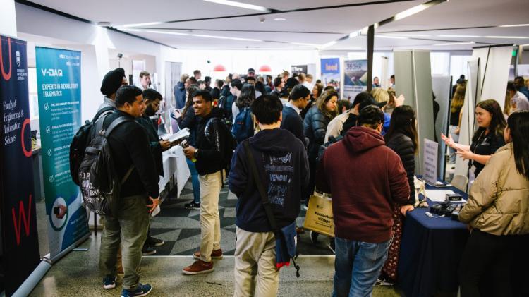 A group of students walking through an expo