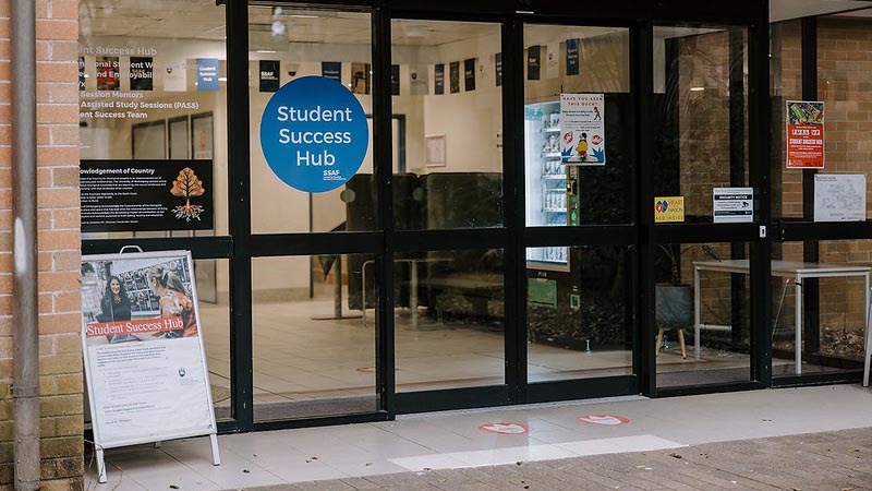 Sliding door with a sticker that reads 'Student Success Hub'