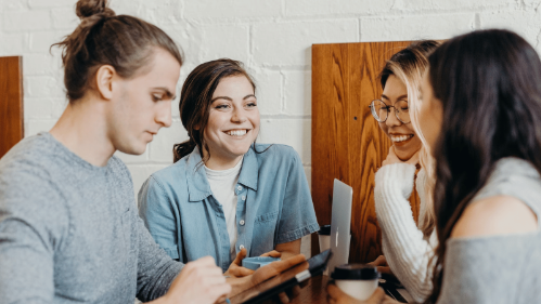 A group of students discussing ideas over coffee