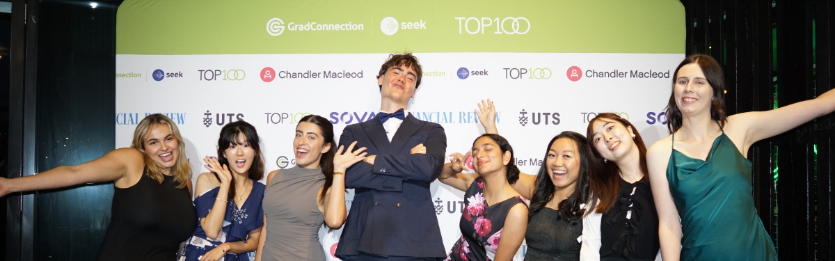 A group of students celebrating at the Top100 Awards Night