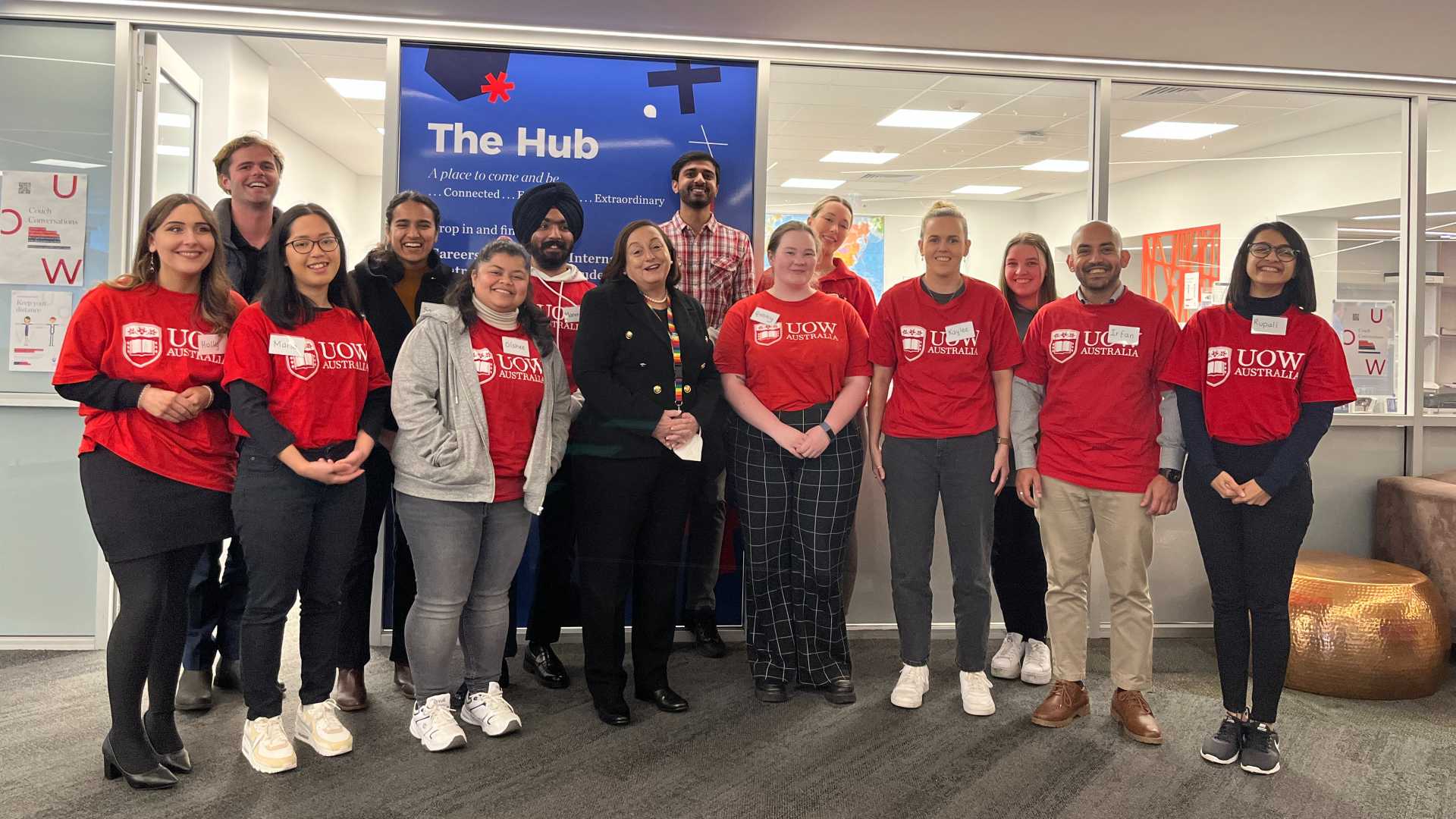 Patricia Davidson and students standing outside the UOW Hub