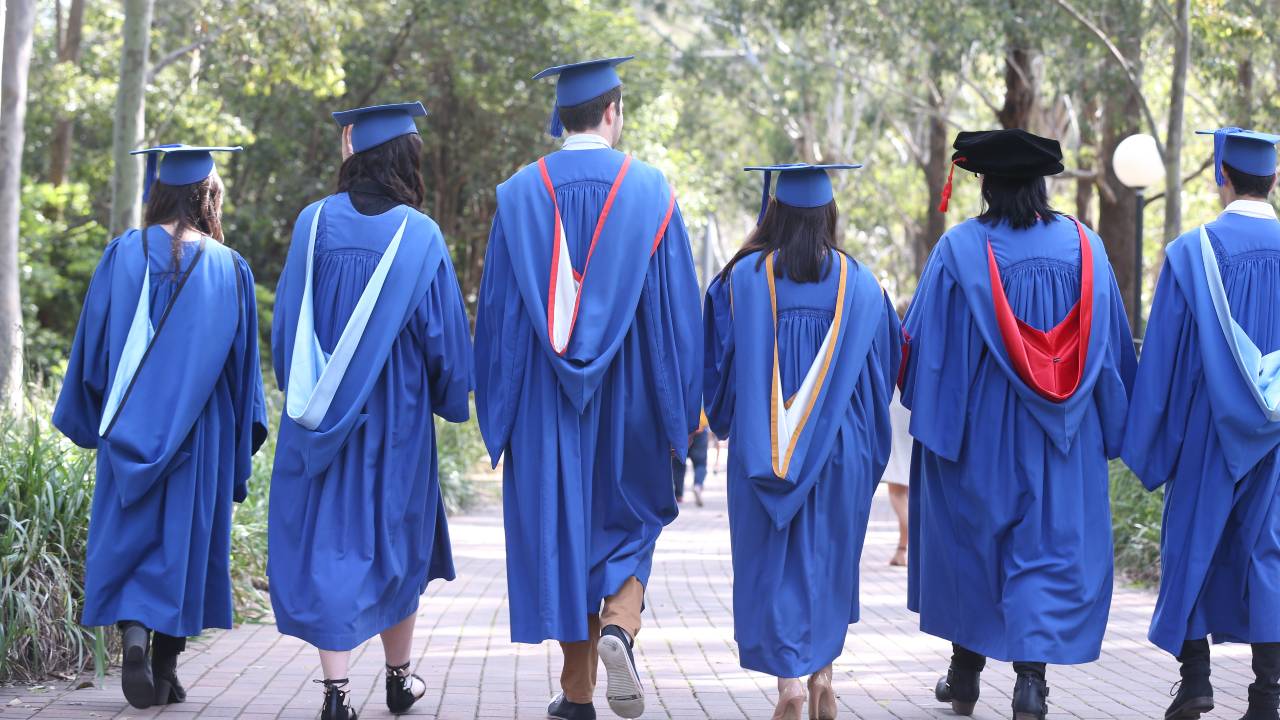 Images of students dressed in graduation robes, attending graduation ceremony at UOW
