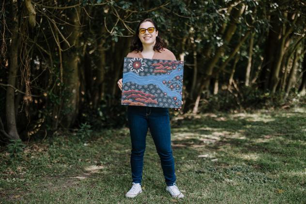 Isabella Horne with her artwork