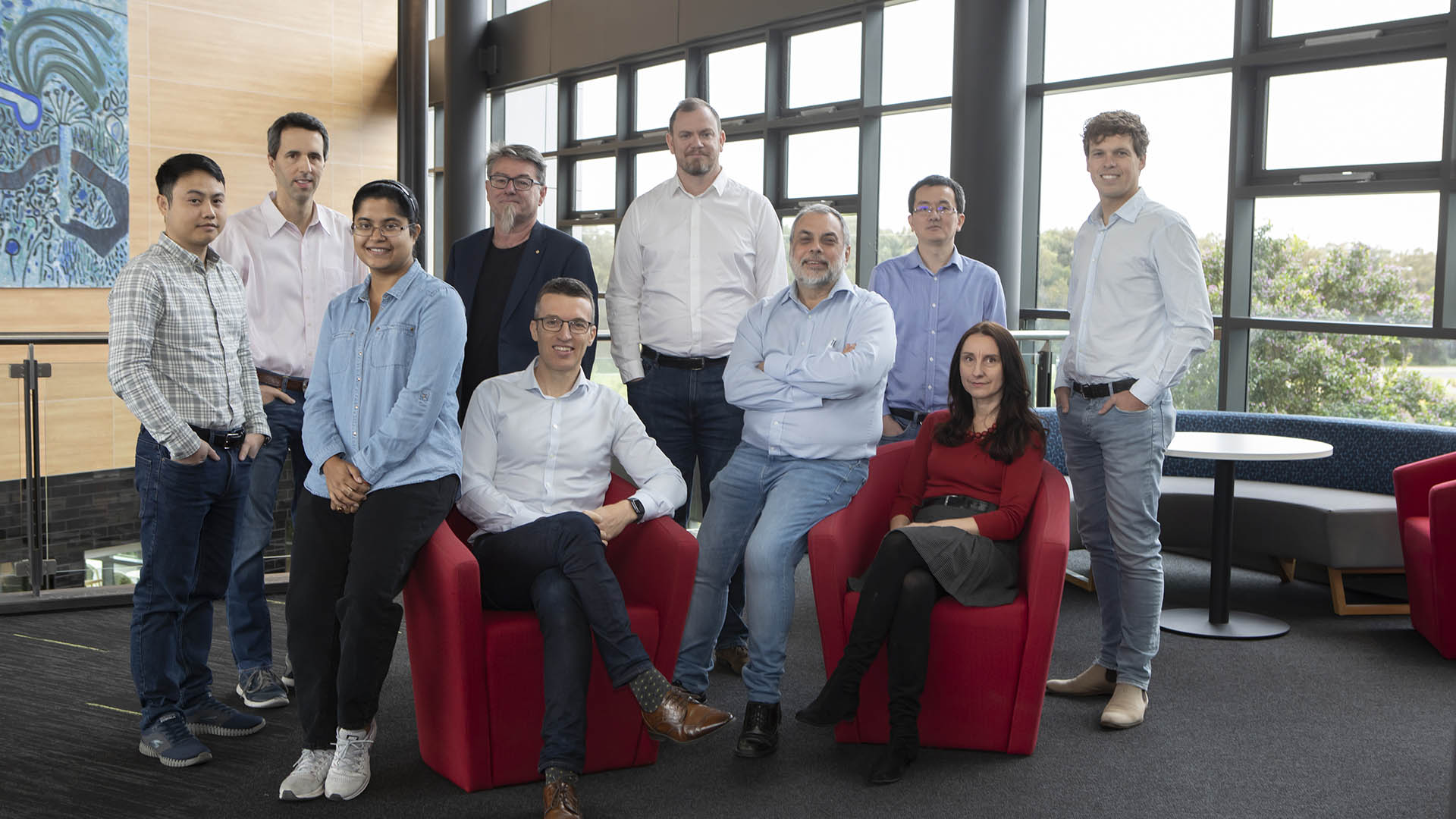 Left-to-right: Linh Hoang, George Tsekouras, Prerna Tiwari (leaning on armrest), Gordon Wallace, Paul Barrett (sitting), Aaron Hodges, Gerry Swiegers (leaning on armrest), Chong-Yong Lee, Klaudia Wagner (sitting), Jef Pennings