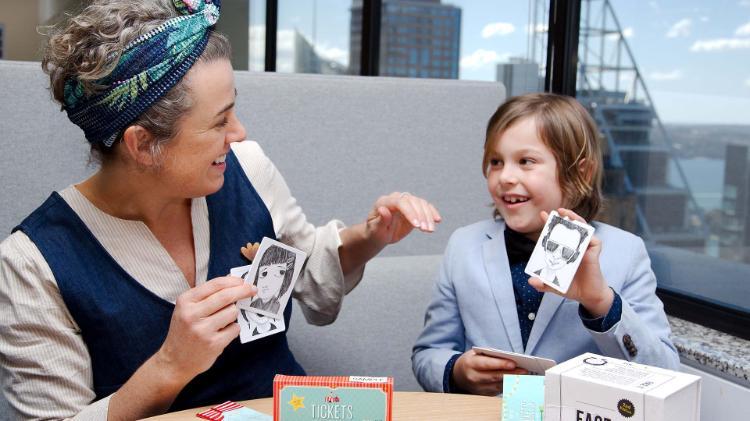 Kimberley O'Brien and Benji Rocker playing with Best of Friends program cards