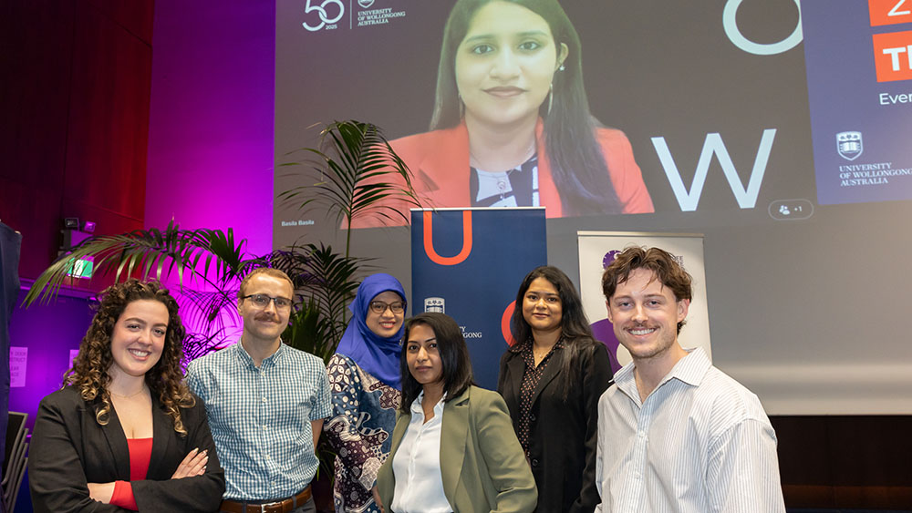 The seven finalists at the 2026 UOW Three-Minute Thesis final.