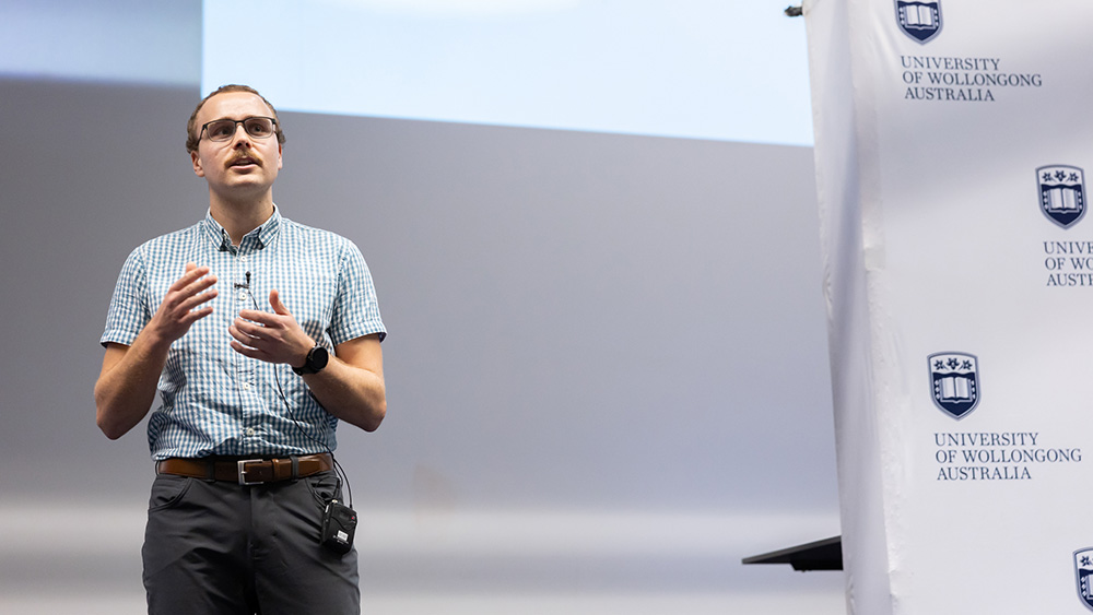 UOW 2026 Three Minute Thesis (3MT) Final winner Kiarn Roughly gives his presentation.