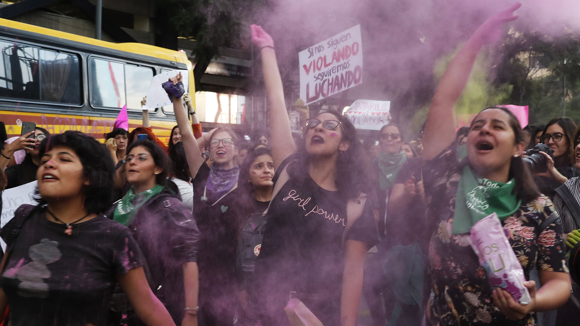Women toss pink glitter during a protest march demanding justice and for their safety, sparked by two recent alleged rapes by police, in Mexico City, Friday, Aug. 16, 2019. (AP Photo/Marco Ugarte)