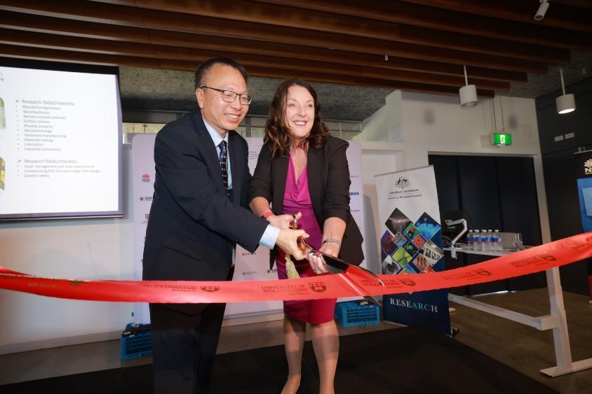 Prof Zhengyi Jiang and Minister Alison Byrnes cutting ribbon
