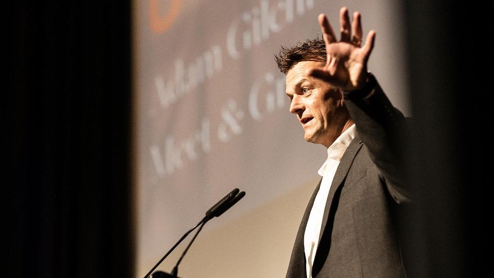 Adam Gilchrist speaking at lectern
