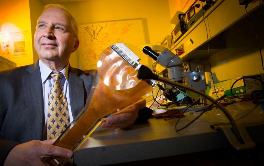 A man sits in a laboratory environment and stares away from the camera. Photo: Paul Jones