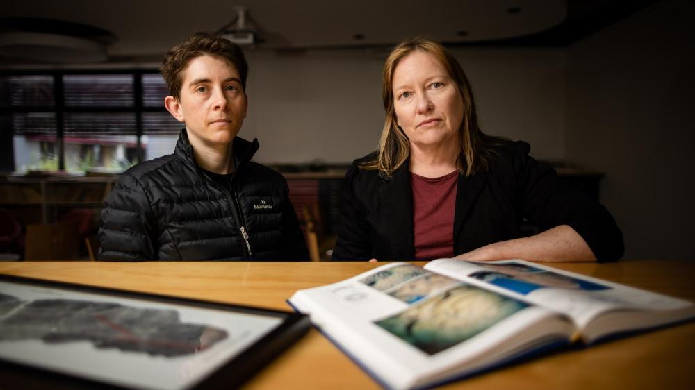 PhD student Ariella Arzey and Professor Helen McGregor have a sombre expression. Photo: Michael Gray