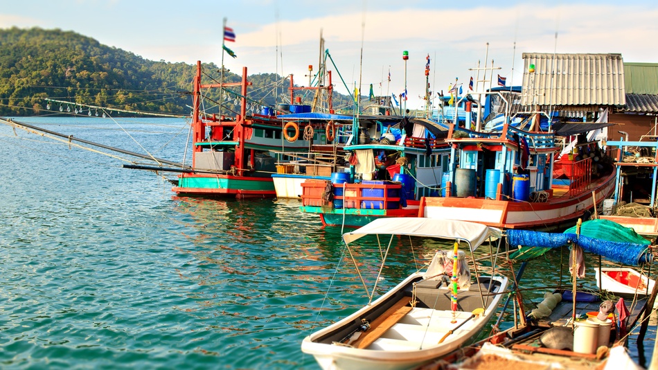Fishing boats in Ban Ao Salad harbor, Koh Kut island. Thailand and Cambodia border dispute. Credit: Shutterstock, asset: 761170588