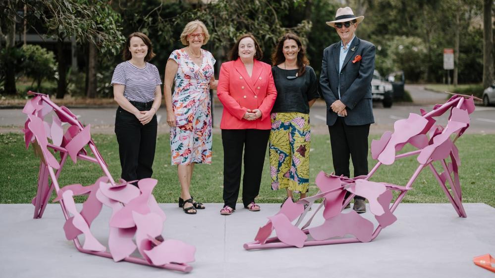 Professor Sue Bennett, Jenny Green, Professor Patricia M Davidson, Phillippa Webb and an unknown man stand behind Beautopia. Photo: Michael Gray